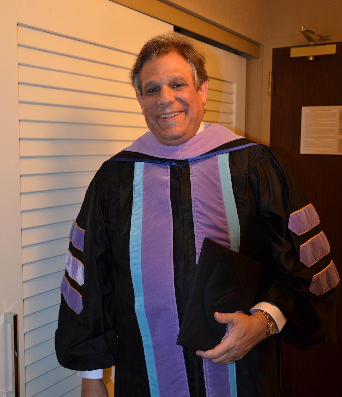 Dr. Friedler wearing graduate gown